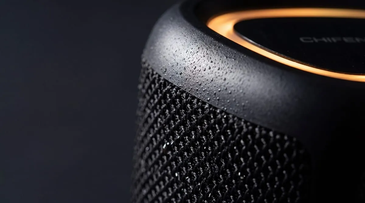 CHIFENCHY speaker close-up showing honeycomb-hex grille and passive radiator